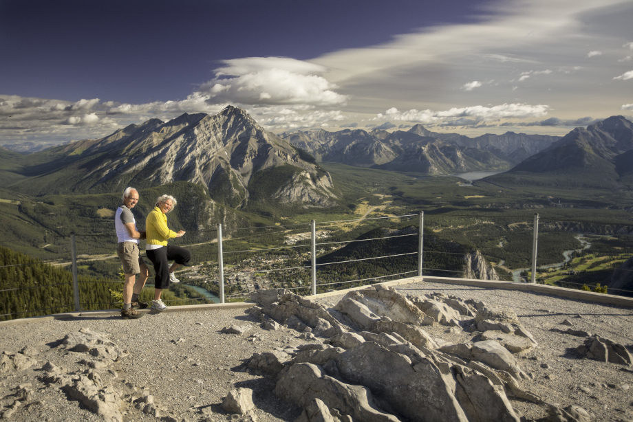 Older couple looking at the view of Banff from Sulphur Mountain in Banff National Park