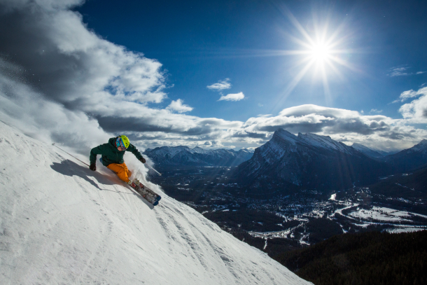 Man skiing a steep drop at Mt. Norquay in Banff National Park