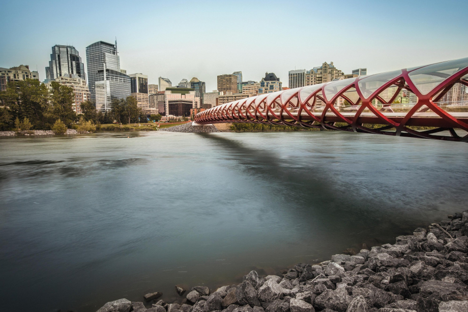 A landscape view of the Peace Bridge crossing the Bow River.