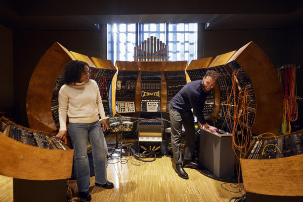 couple exploring TONTO at Studio Bell, home of the National Music Centre
